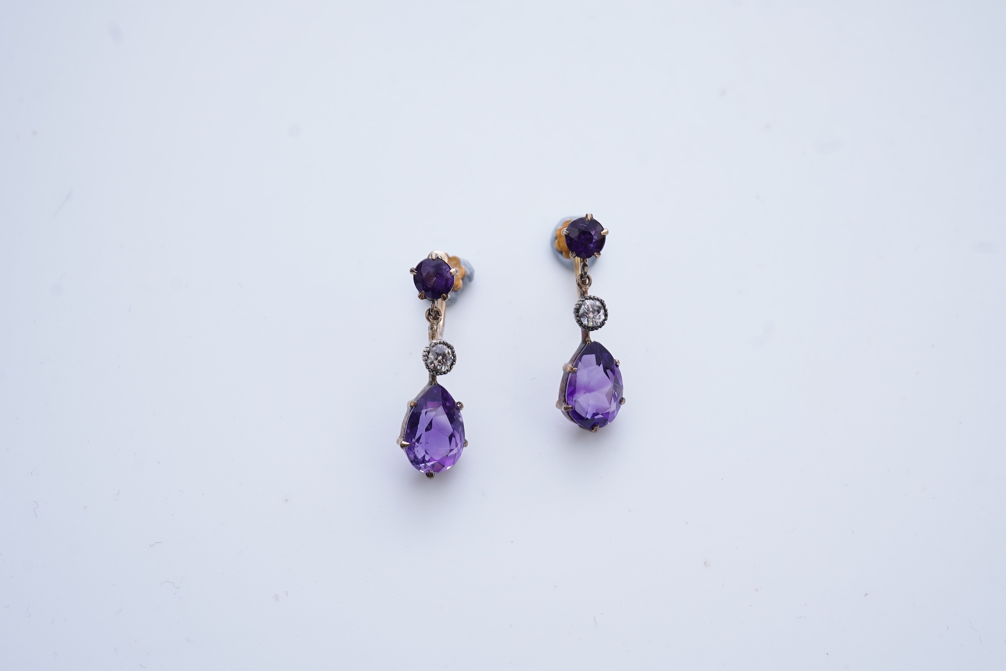 A pair of amethyst and diamond earrings, early 20th century